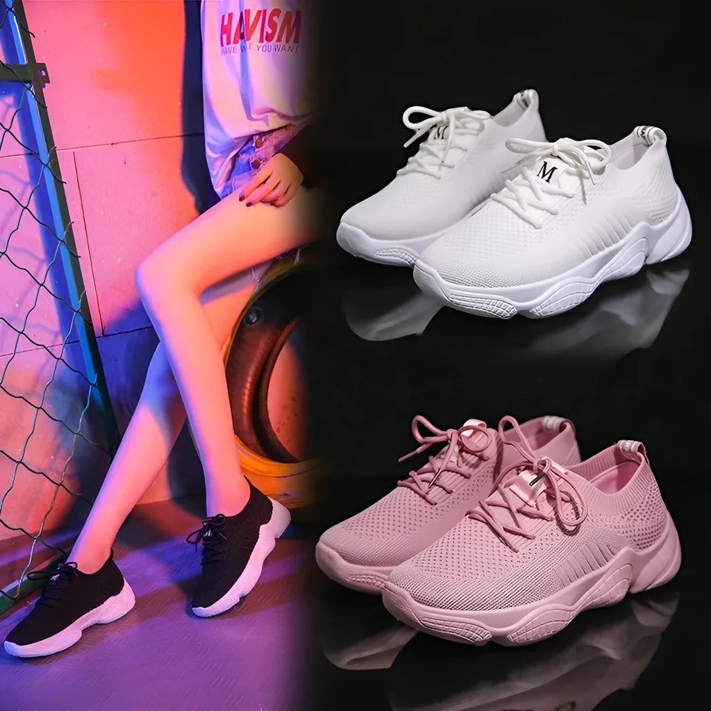Women's white low-top sports shoes with a woven upper and thick rubber sole.