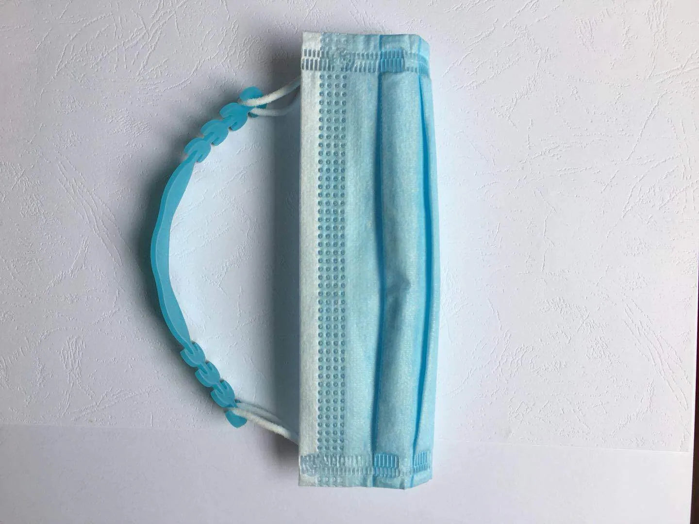 Eight silicone protective buckles in different colours for cable organisation