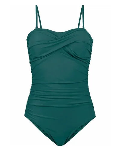 Plus size one-piece swimsuit with open back and retro wave design in black, green, and wave point colours