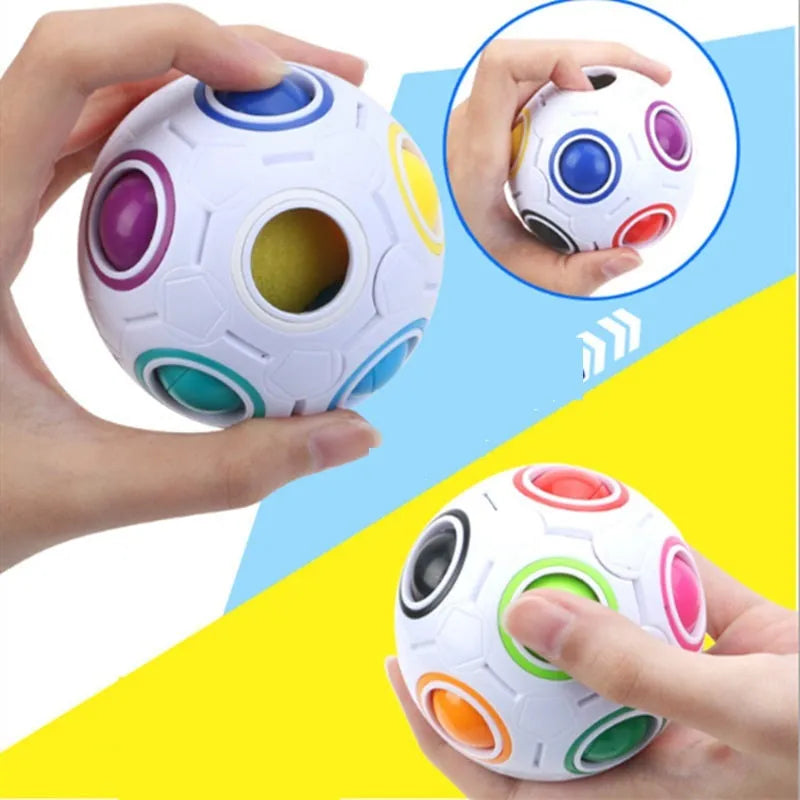 A 5.5 cm diameter rainbow-coloured plastic puzzle ball with a hexagon pattern.