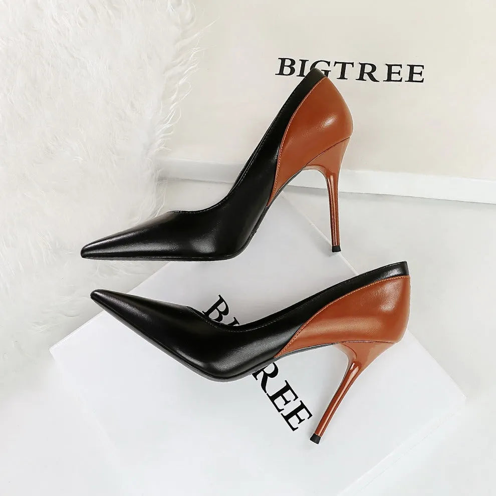 Retro-style black and creamy white women's stiletto high heels with pointed toe for banquet wear.