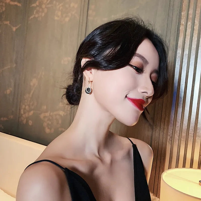 Black geometric round alloy earrings with retro Hong Kong style, showing 3.6cm drop length.