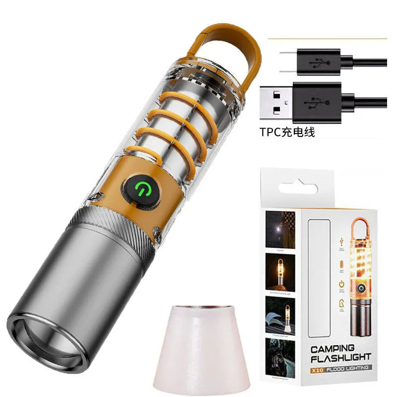 Orange and beige coloured multifunctional flashlight with keychain and optical zoom lens.