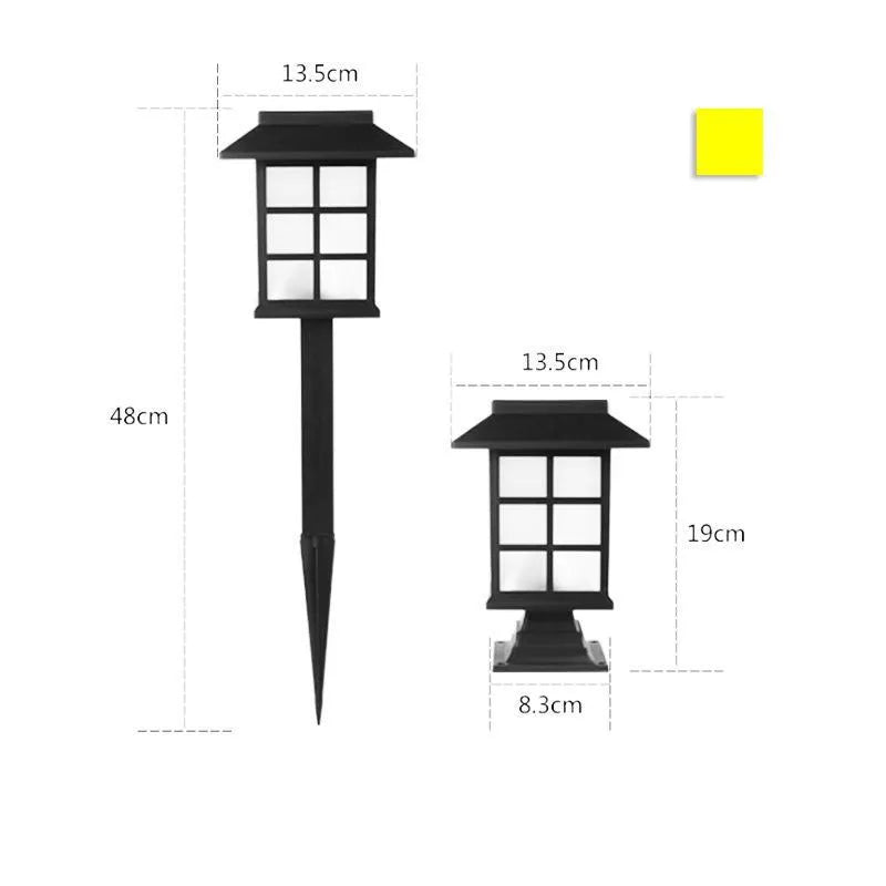 Black solar outdoor LED lawn light with window-style apertures emitting soft white or warm white light