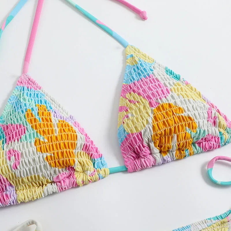 Women's multicolour floral triangle bag bikini swimsuit with split printed design and smocking craft detail.