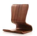 Bamboo wood tablet phone holder on desk with an Apple iPad propped up in landscape mode