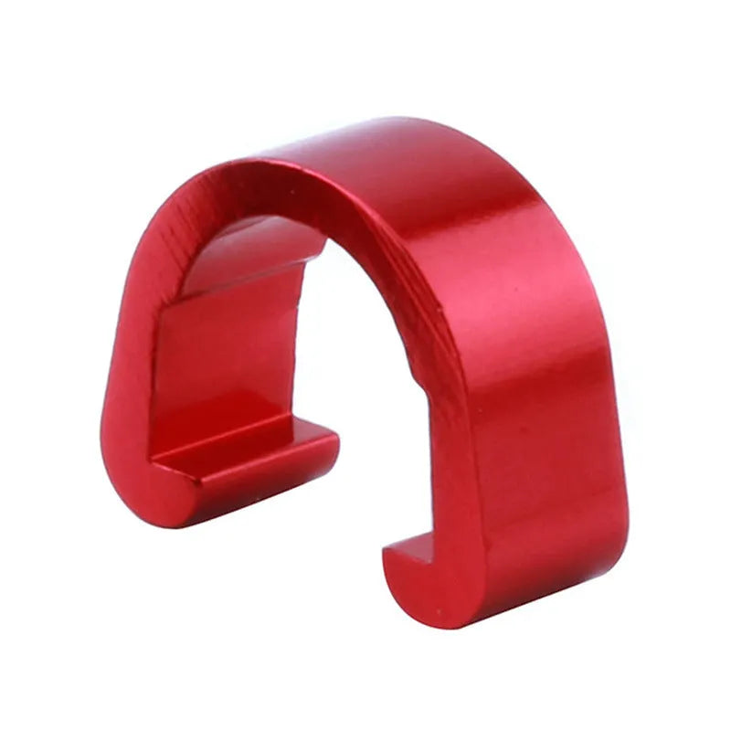 Ten small aluminium C-shaped buckles in assorted colours including black, blue, gold, and red.