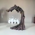 Grey resin Halloween ghost swing ornament with modern art design on display