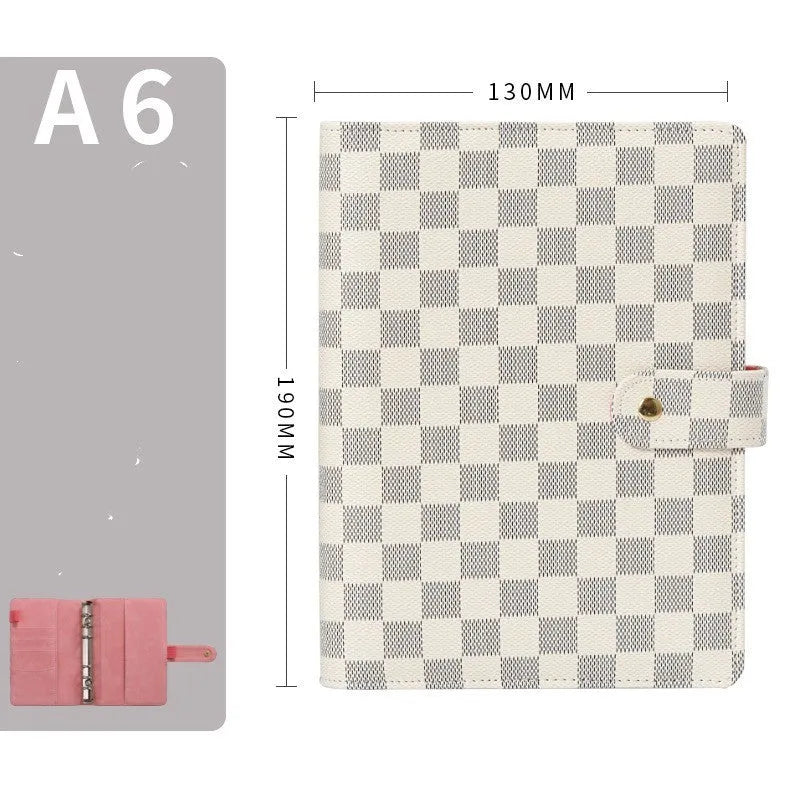 Loose-leaf checkered notebook with imitation leather cover in red, black, white or brown, showing ring binder and A5 size.