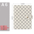 Loose-leaf checkered notebook with imitation leather cover in red, black, white or brown, showing ring binder and A5 size.