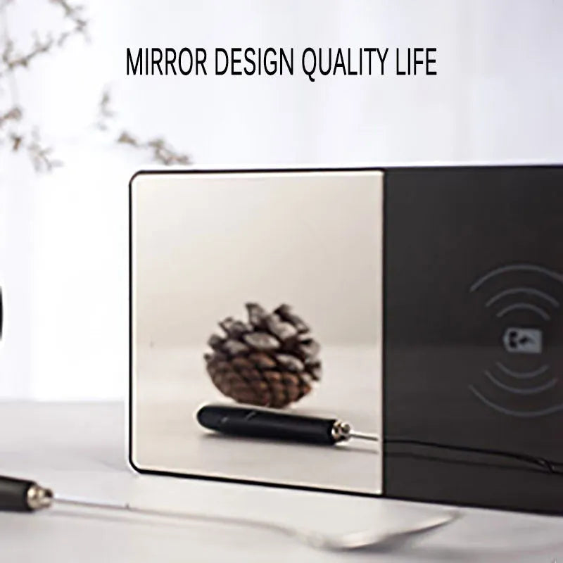 2-in-1 heated mug cup warmer and wireless charger on a desk with a coffee mug and smartphone