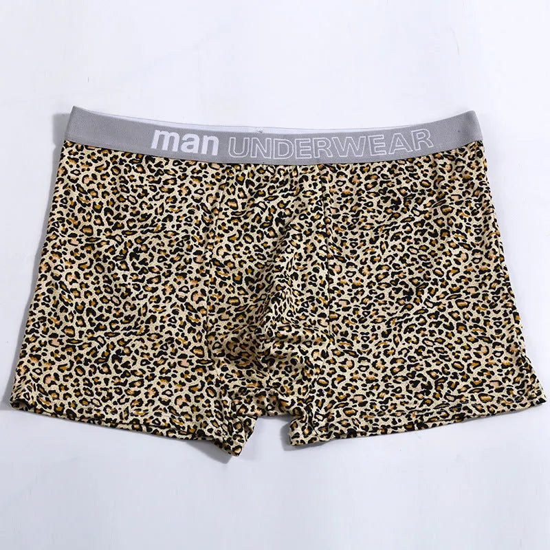 Men's loose leopard print underwear in milk silk polyester fabric showing mid-waist design
