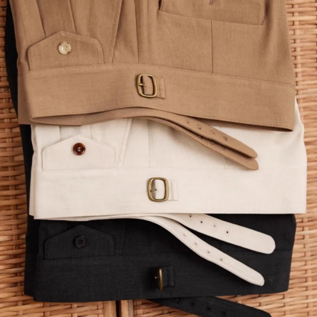 Men's slim fit straight leg business trousers in wrinkle-resistant polyester fabric.