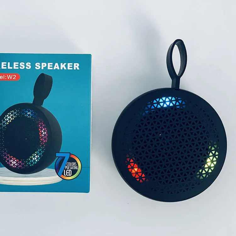 Pink mini Bluetooth speaker with plastic shell and button controls, 82x82x40mm