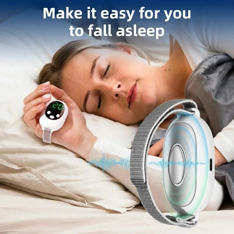 White intelligent sleep aid device handheld remote control with sleep bracelet on a dark background.