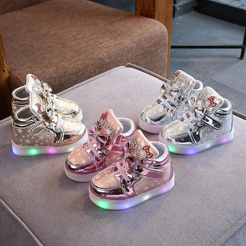 Children's LED trainers with magic button and illuminated soles in golden, pink or silvery colours