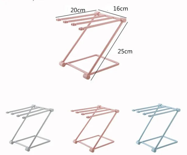 Foldable plastic towel shelf with vertical storage in light pink Nordic kitchen organiser