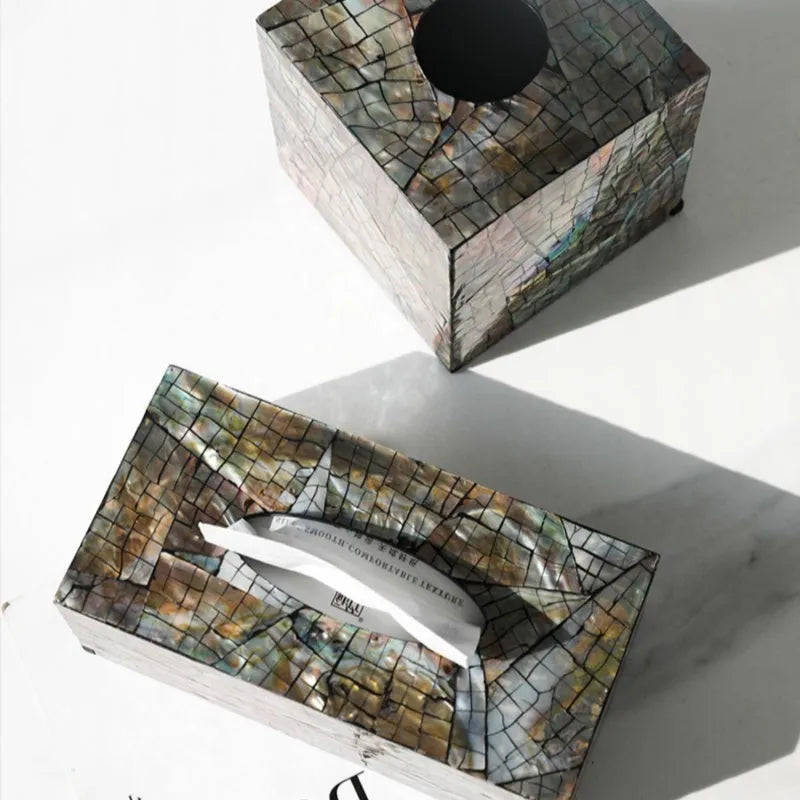 Natural shell decorative storage box in a minimalist design on a coffee table.