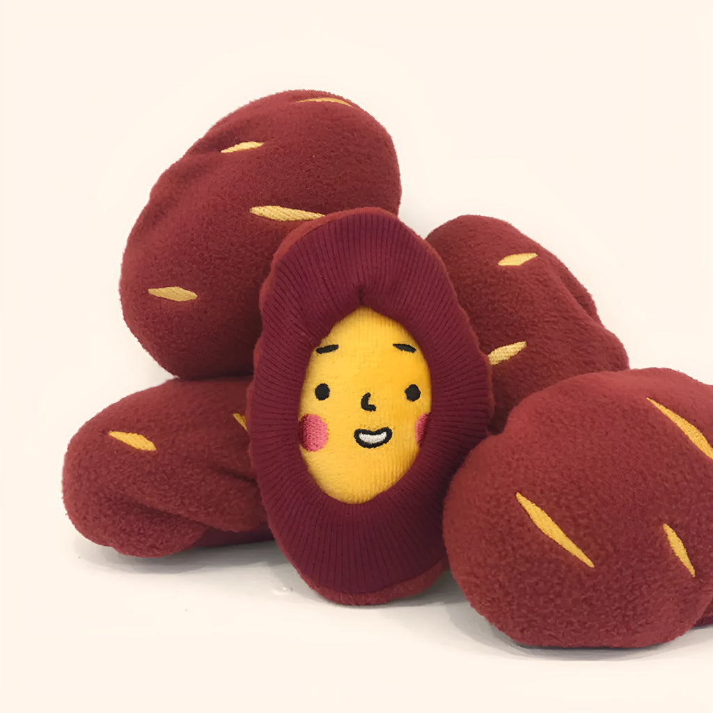 Red silicone sweet potato pet puzzle toy with hidden treat compartments for dogs