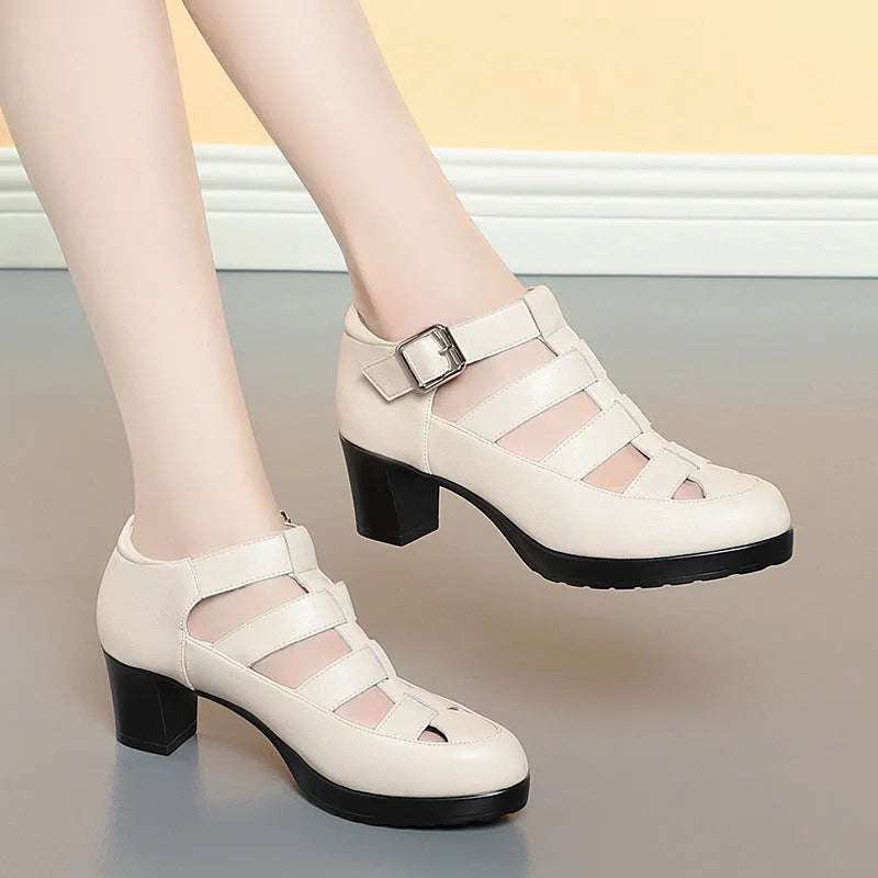 Beige women's closed toe sandals with a chunky heel, woven hollowed upper, and ankle strap buckle.
