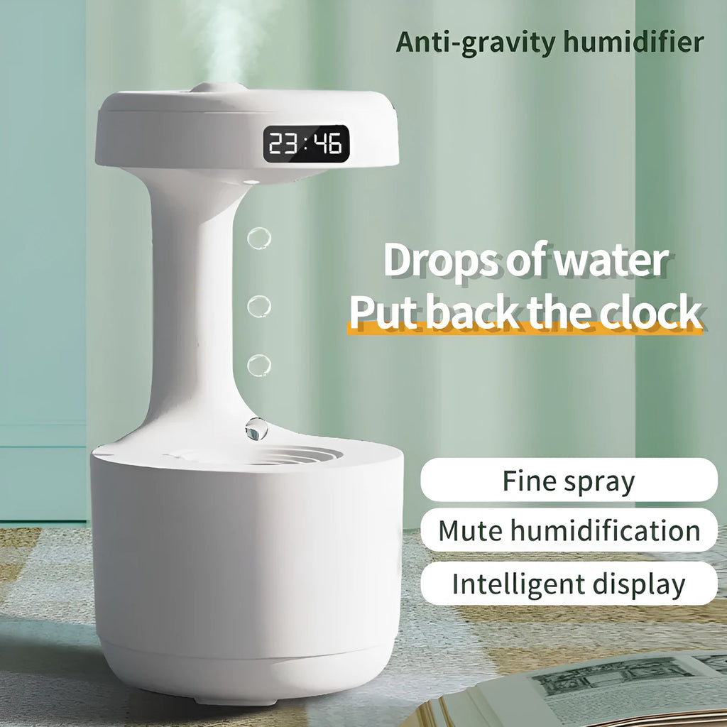 White columnar anti-gravity humidifier with LED clock display emitting mist on a wooden desk.
