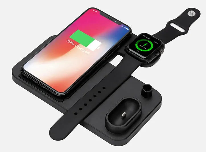 Black 4-in-1 wireless charger with magnetic phone stand charging an iPhone, Apple Watch, and AirPods.