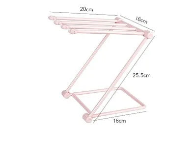 Foldable plastic towel shelf with vertical storage in light pink Nordic kitchen organiser