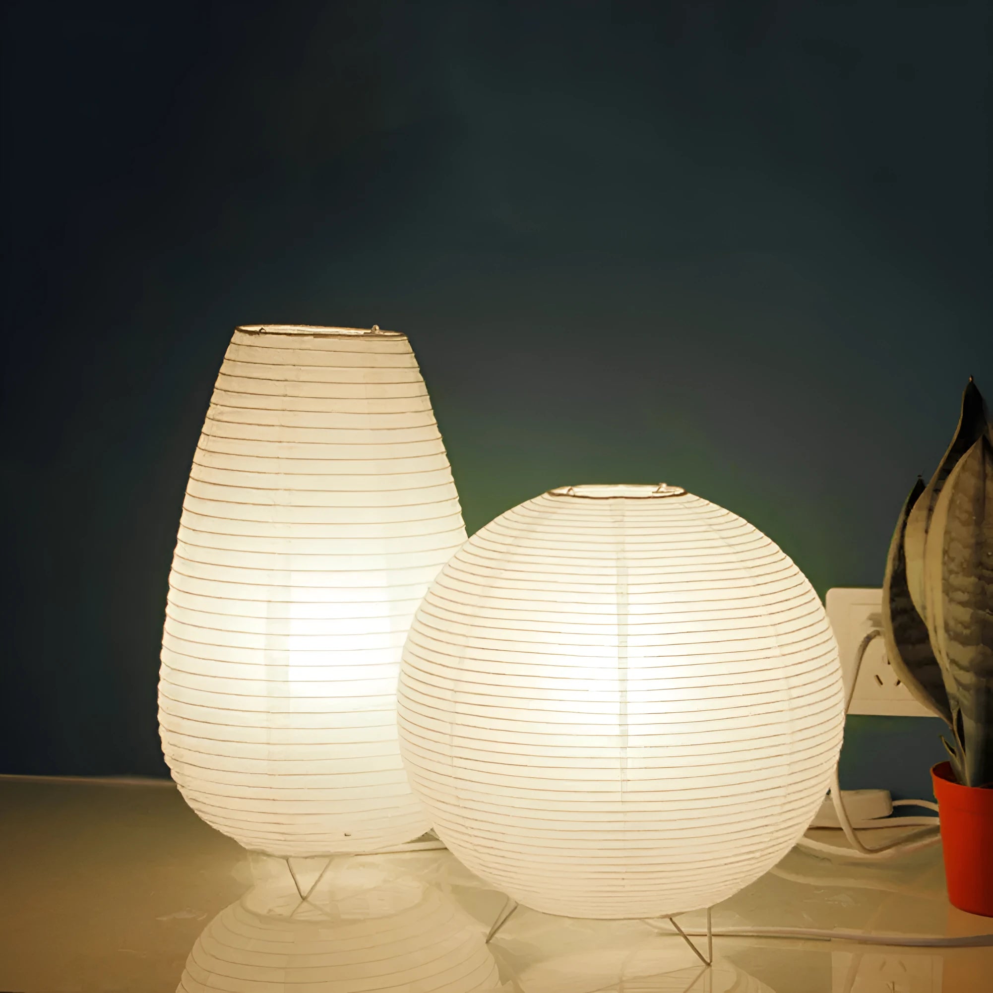 White traditional rice paper table lamp with E14 bulb holder on wooden desk