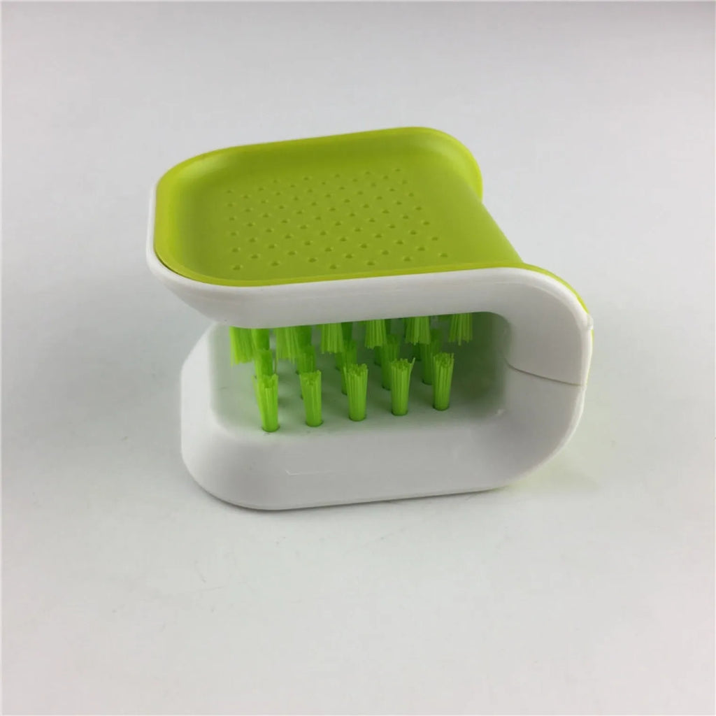 Blue U-shaped plastic brush for cleaning kitchen knives and forks.