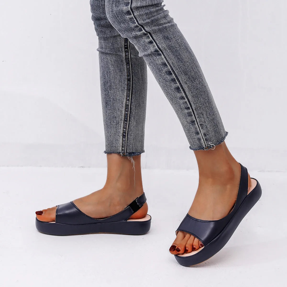 Women's summer fish mouth flat sandals in solid colour with back strap design, side hollow detail, artificial PU upper, rubber sole