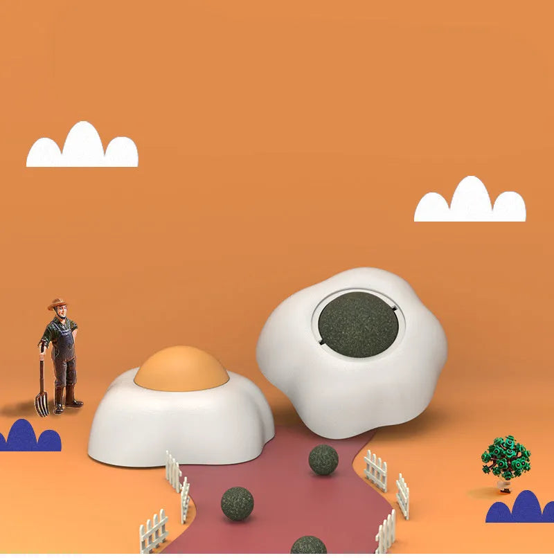 Catnip ball toy with suction cup attached to wall, showing Fried egg and Poached egg shape options