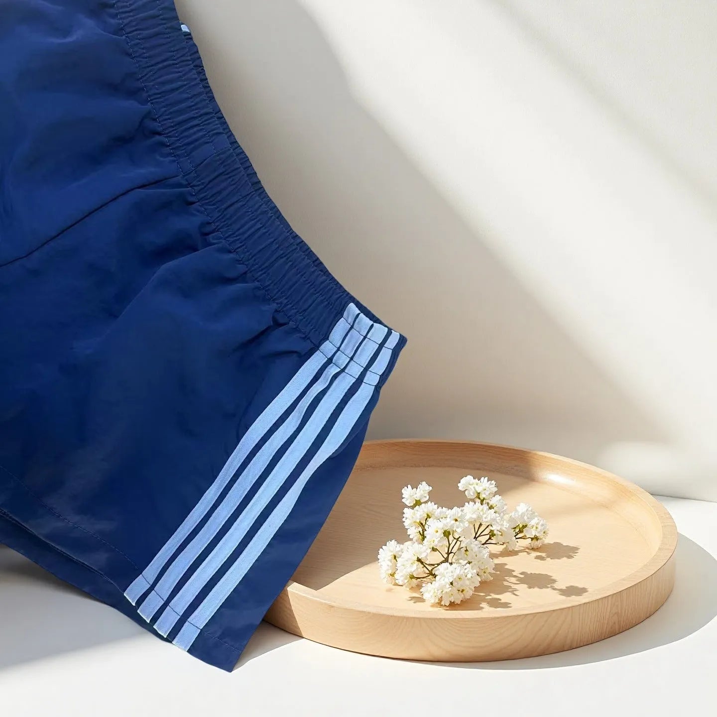 Men's navy blue nylon sport shorts with high-waist elastic waistband