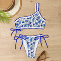 Blue one-shoulder floral bikini for women on a mannequin, front view.