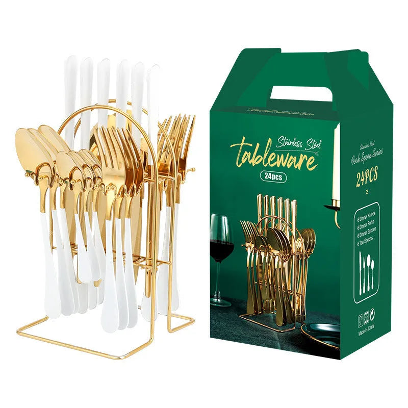 Gold stainless steel knife fork spoon cutlery set with storage rack on a table.