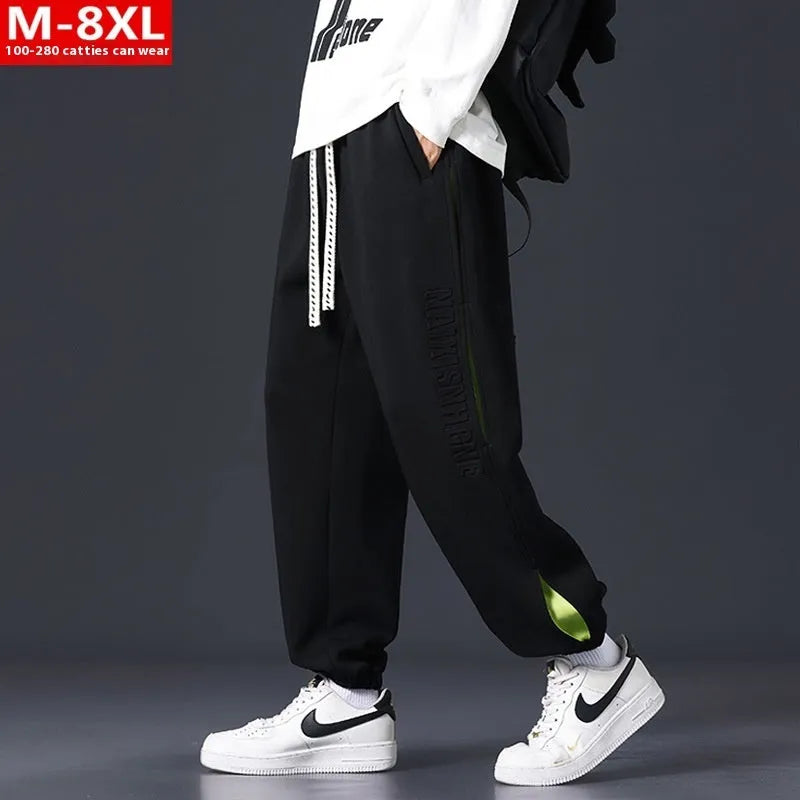 Men's cotton pants with ankle banded design and stitching details in black colour