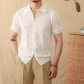 Men's light brown cotton cardigan with lapel collar, zipper front, and short sleeves laid flat.