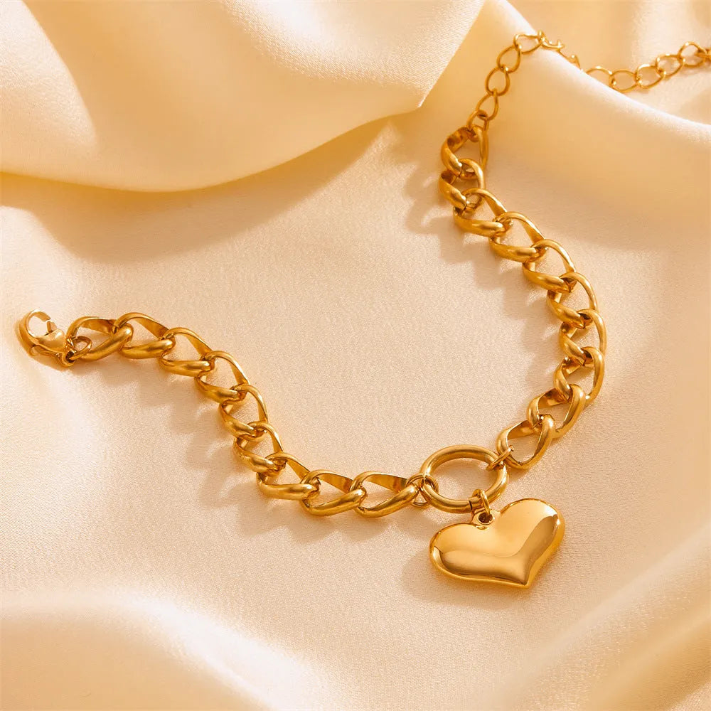 Titanium steel metal bracelet with round chain and heart detail in gold N510 colour