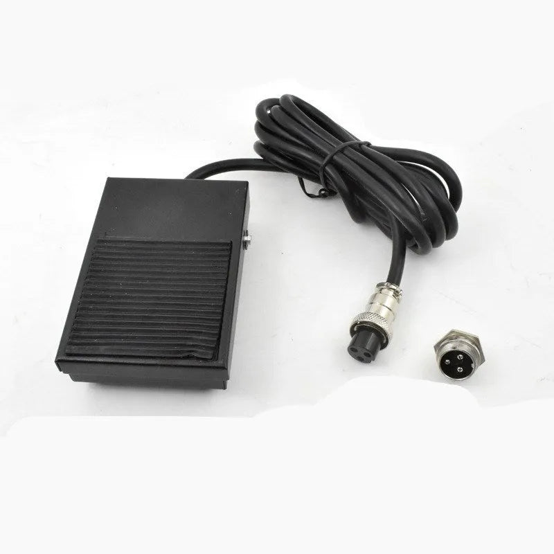Metal welding machine foot switch with rubber pedals and a long black cable.