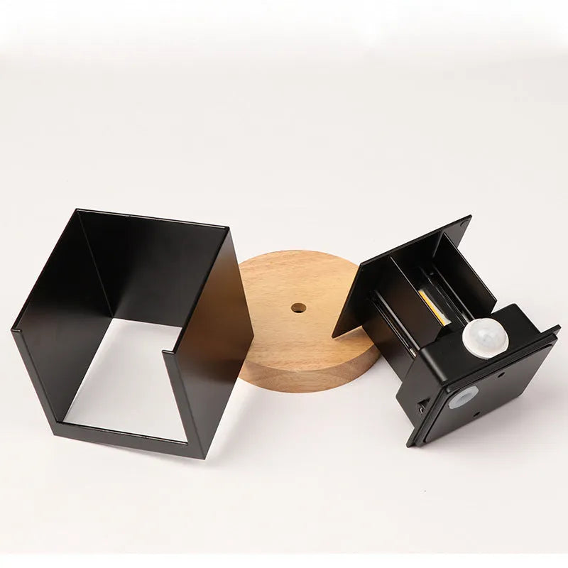Aluminium cube wall lamp in black, grey, or white colours with 360-degree light distribution