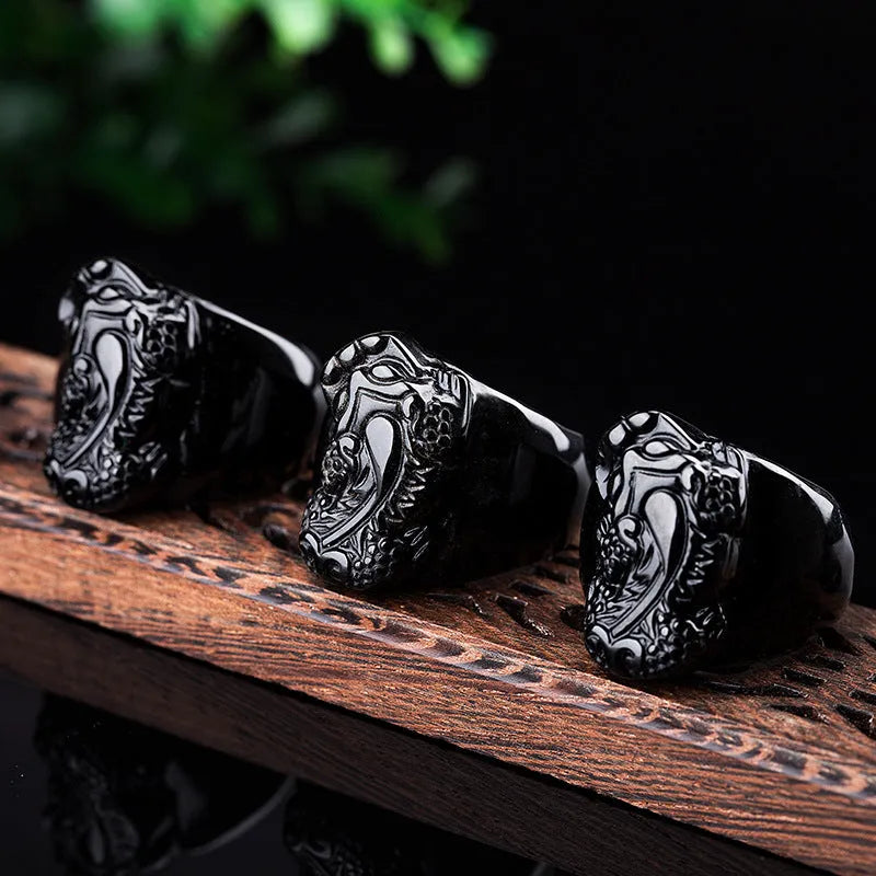 Men's domineering obsidian Pixiu thumb ring with natural gold sheen on an alloy band.