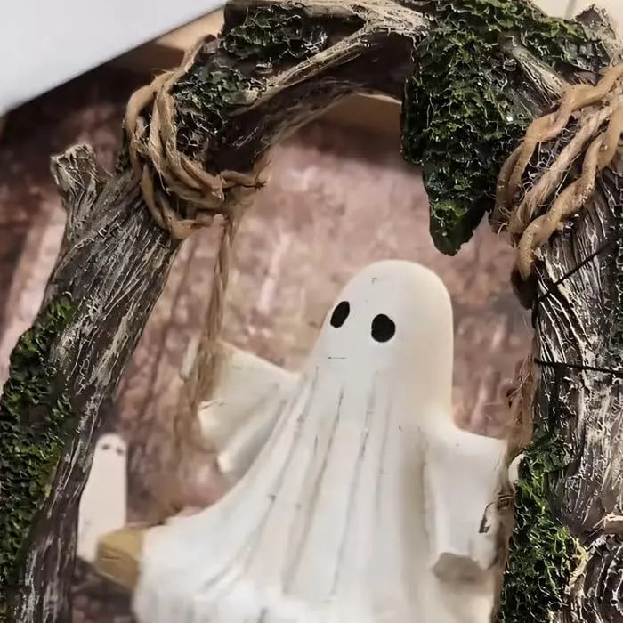 Grey resin Halloween ghost swing ornament with modern art design on display