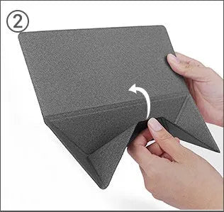 Blue portable laptop cooling bracket with foldable design on a wooden table.