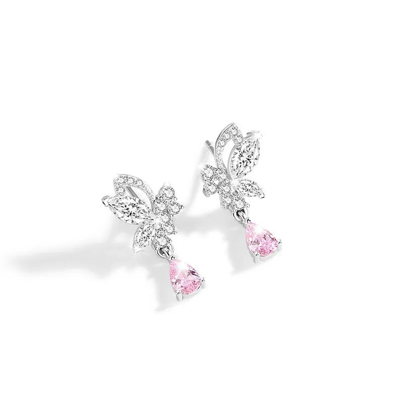 A pair of silver butterfly stud earrings with clear crystals on a white background.