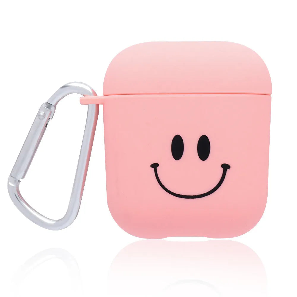 Black and pink polycarbonate AirPods case covers with decorative flower and smiley face back designs.