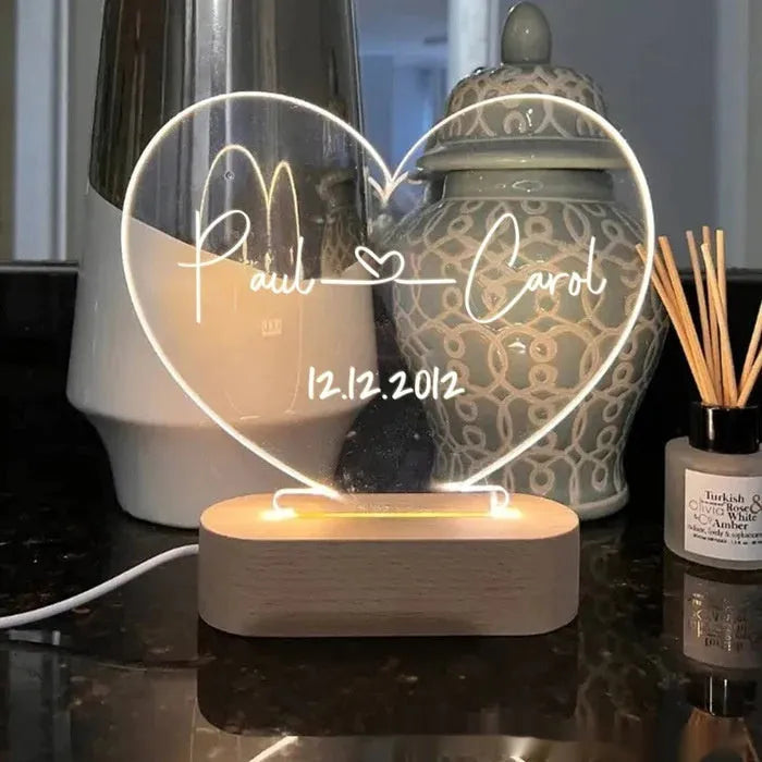 Personalised acrylic night light displaying custom names and date for Valentine's Day gift.