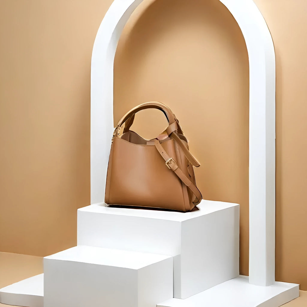 Women's tea brown genuine leather crossbody bag with bucket shape and crossbody strap