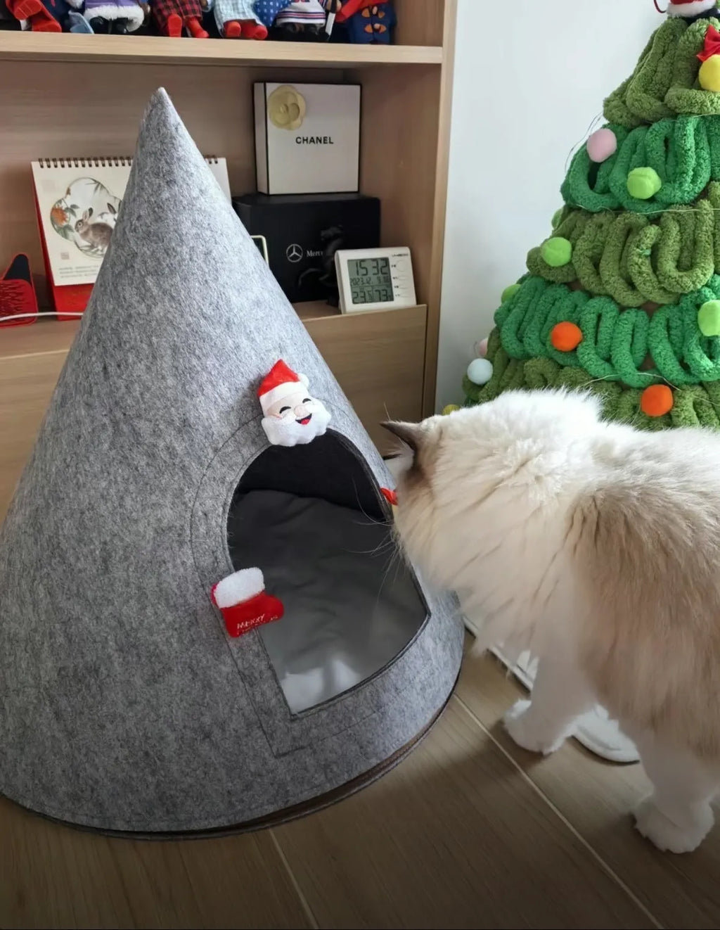 Grey cone-shaped felt cat house measuring 50cm wide with enclosed tent design
