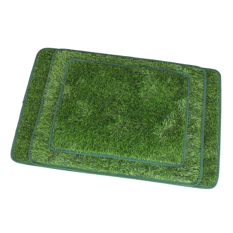 Green washable dog grass pee mat with realistic lawn texture on a patio.