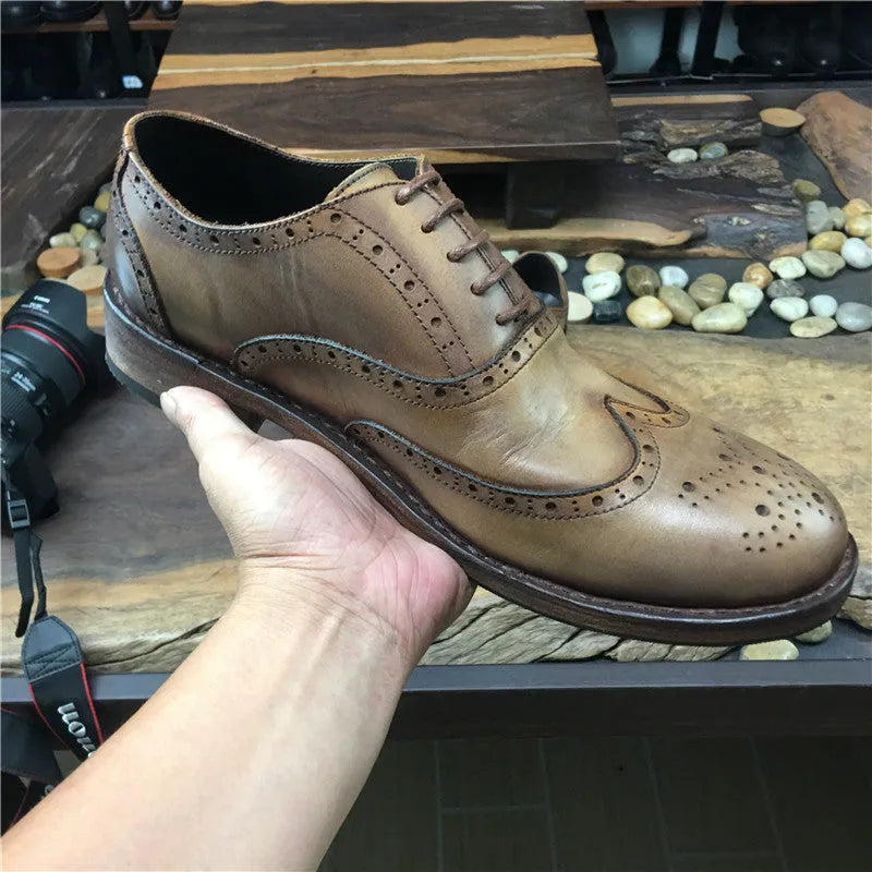 Men's light brown distressed leather lace-up shoes with hand-carved vintage detailing