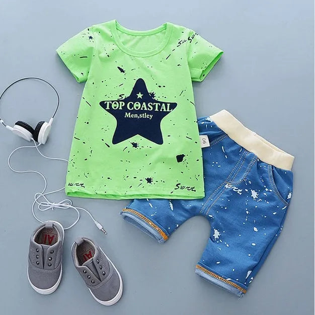 Baby boy wearing a blue cotton short sleeve t-shirt and matching shorts summer outfit